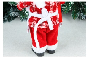 Detail of Christmas chef doll back showing red plaid outfit and white fabric belt