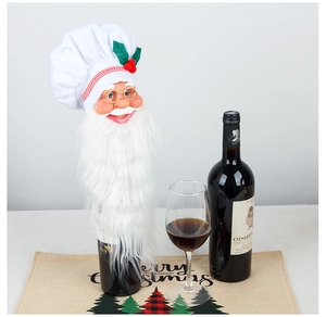 Detail of Santa Claus wine bottle topper with white beard and chef hat decoration