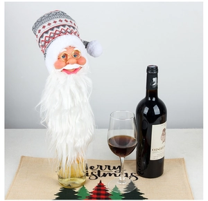 Close-up of Santa wine bottle cover with knitted hat and plush beard for holiday decor