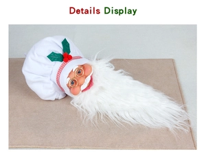 Detail display of Santa Claus wine bottle cover with chef hat and white faux fur beard