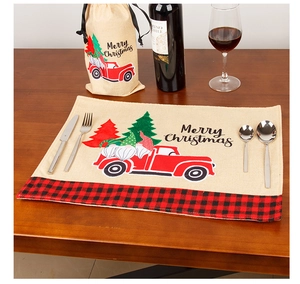 Christmas linen placemat and wine bag set with festive gnome and red truck design