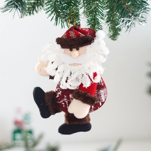 Classic Santa plush ornament with red striped hat and white beard on a Christmas tree