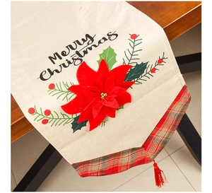 Detail of Christmas table runner with 3D poinsettia flower and Merry Christmas script