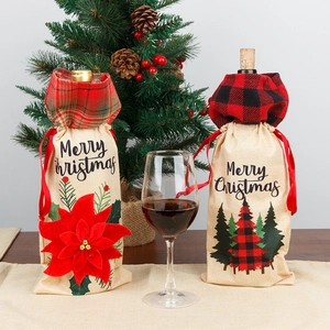 Linen Christmas wine bottle covers with buffalo plaid trim and festive embroidery
