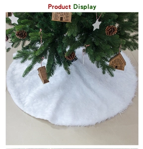Detail of white faux fur Christmas tree skirt with soft plush texture for holiday decor