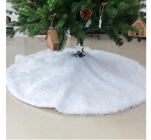 Close-up of white plush Christmas tree skirt with soft faux fur texture for holiday decor