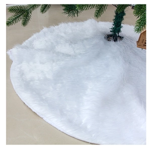Close-up of plush white Christmas tree skirt showing thick long-hair faux fur texture