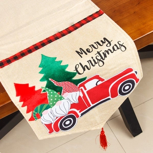 Linen Christmas table runner with retro truck, gnomes, and red buffalo plaid borders