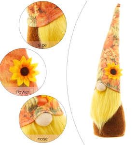 Detailed close-up of the sunflower gnome decoration showing side view and floral textures