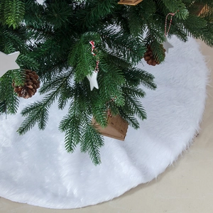Plush white faux fur Christmas tree skirt for holiday base decoration and floor carpet
