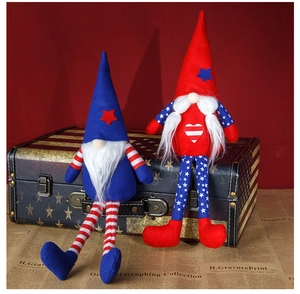 Close-up of patriotic Fourth of July gnome dolls with red, white, and blue star patterns