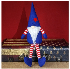 Detail of Fourth of July gnome with blue pointed hat and striped long legs decoration