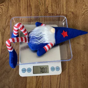 Weight measurement of patriotic American gnome doll with striped legs on a scale