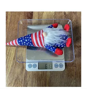 Close-up of a patriotic gnome plush with star-spangled hat on an electronic scale