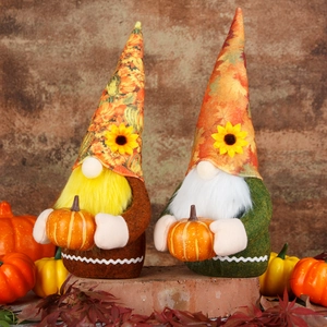 Set of two Thanksgiving gnomes with sunflower hats and pumpkins for autumn decor