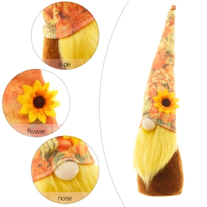 Thanksgiving harvest gnome decor featuring a sunflower hat and long yellow beard on white background