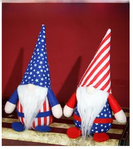 Detail of two patriotic American Independence Day gnomes with flag patterns on a wooden box