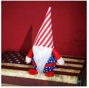 Close-up of American flag patriotic gnome plush on a vintage suitcase background