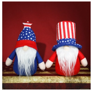 Detail of 4th of July gnomes set with stars and stripes patterns on a rustic box