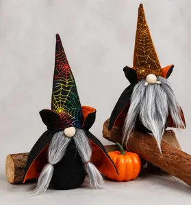 Detail of Halloween vampire gnomes with spider web hats and black cloaks on a wooden base