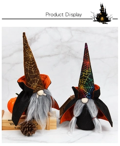 Detail of Halloween gnome figurines with spider web hats and black orange capes