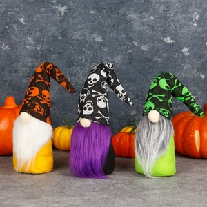 Three Halloween gnomes with skull patterns and long beards for home holiday decoration