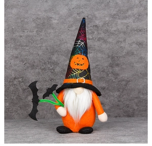 Detail of Halloween gnome featuring black spider web hat and orange plush body