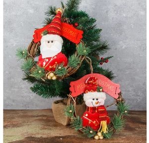 Detail of Christmas rattan wreath with Santa, Snowman, pine needles and Merry Christmas banner