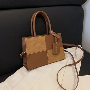Contrast patchwork handbag with brown leather and suede checkerboard design