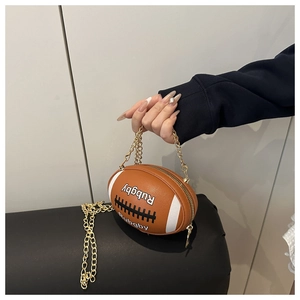 Detail of rugby-shaped brown PU leather crossbody bag with letter print and gold chains