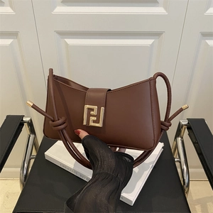 Brown leather underarm bag with gold buckle and stylish chain strap for summer 2025