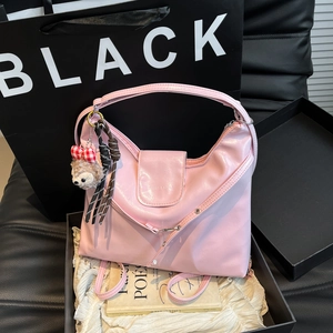 Pink glossy faux leather hobo shoulder bag with plush charm in a premium gift box