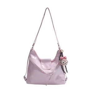 Pink glossy PU hobo bag with adjustable drawstring side and cute brown plush charm