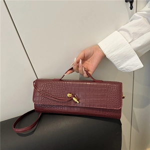 Dark red crocodile pattern baguette bag with gold buckle and adjustable strap