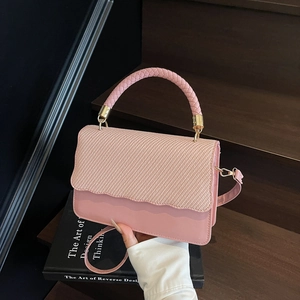 Pink evening shell bag with scalloped edge flap and woven handle for women