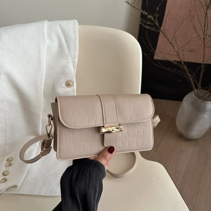 Beige faux crocodile leather underarm bag with gold bamboo clasp for women
