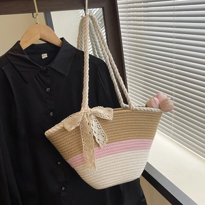 Three-color woven tote bag with lace bow detail and rope handles for summer beach use