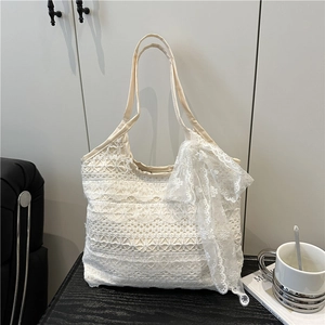 Elegant white lace tote bag with bow detail for summer beach vacation and casual style