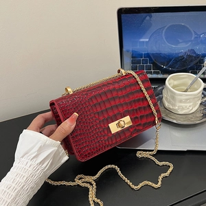 Women's burgundy stone pattern crossbody bag with gold chain and metal lock detail