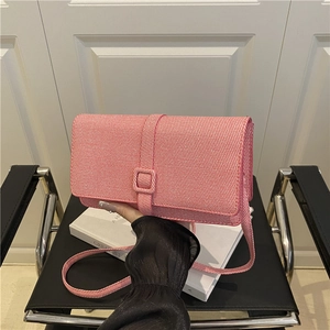Pink textured tweed crossbody bag with square buckle flap and thin shoulder strap