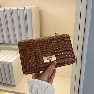 Deep brown croc-effect chain shoulder bag with gold hardware and flap closure