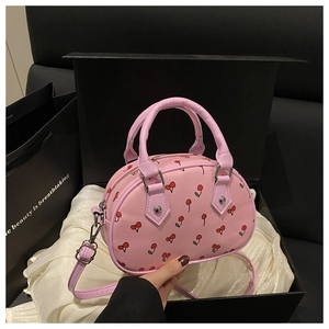 Pink cherry print crossbody bag detail in luxury gift box with adjustable silver hardware