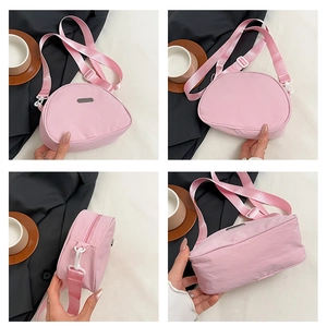 Detailed four-way view of pink nylon crossbody bag showing the shape and strap