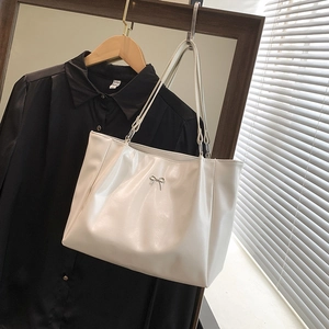 Minimalist creamy white large tote bag with metallic bow and double shoulder straps