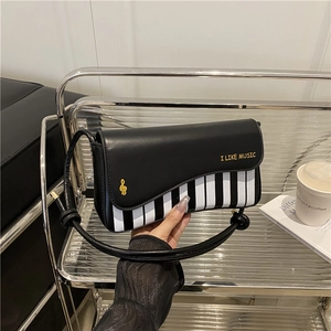 Minimalist piano pattern crossbody bag with musical notes and gold embroidery