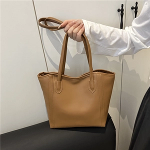 Brown minimalist PU leather tote bag with dual handles and detachable shoulder strap