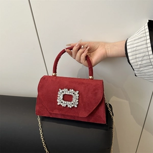 Red suede crossbody bag with sparkling square crystal buckle and gold chain strap