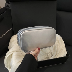 Silver metallic rectangular chain bag with mirror finish and stylish gift packaging