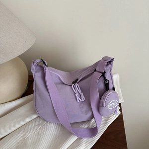 Minimalist light purple nylon crossbody tote bag with adjustable strap and small coin pouch