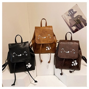 Three mini cat-themed PU leather backpacks in black and brown with cute paw prints